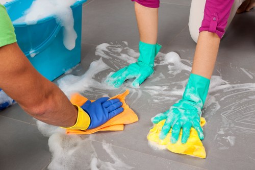 Professional carpet cleaner working on a carpeted area inside a home