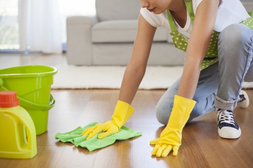 Professional carpet cleaning team demonstrating safe working practices